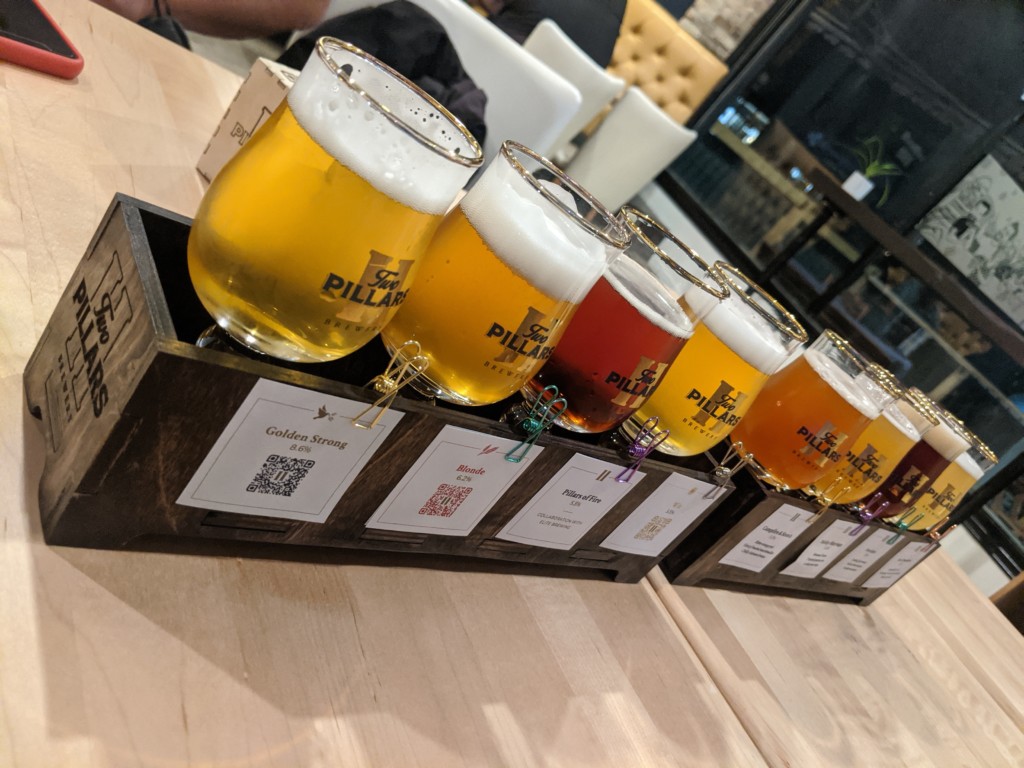 A photo of a beer flight from Two Pillars Brewery.