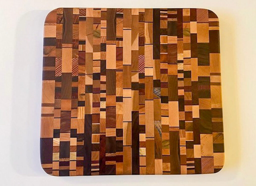 A cutting board made from scrap pieces of wood.