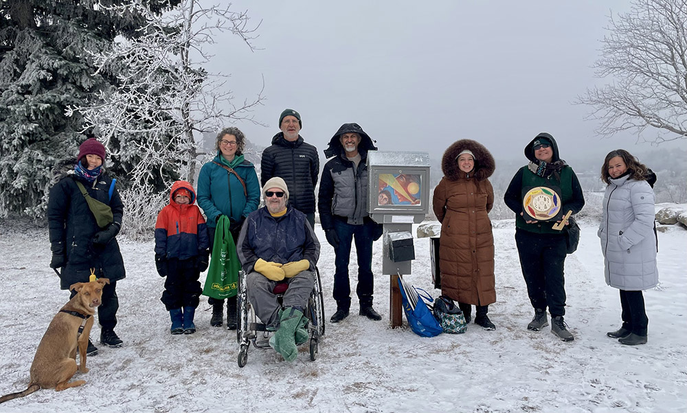 Fuse33 Makers stand around a Mini Gallery in the snow.